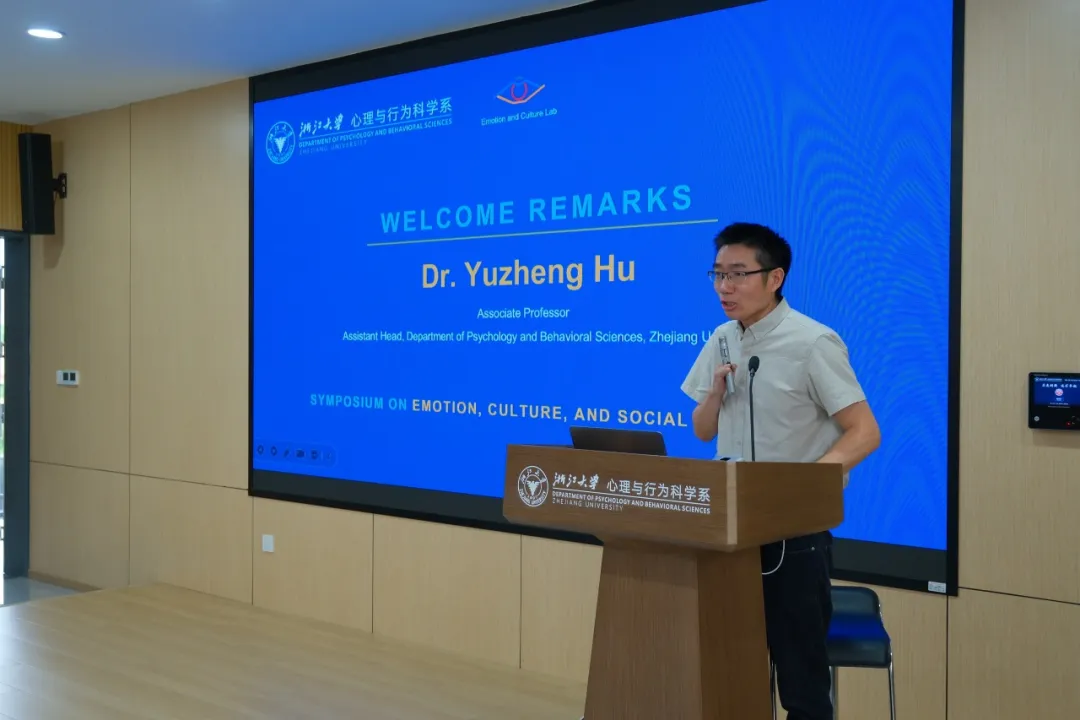 Professor Yuzheng Hu delivering welcome remarks